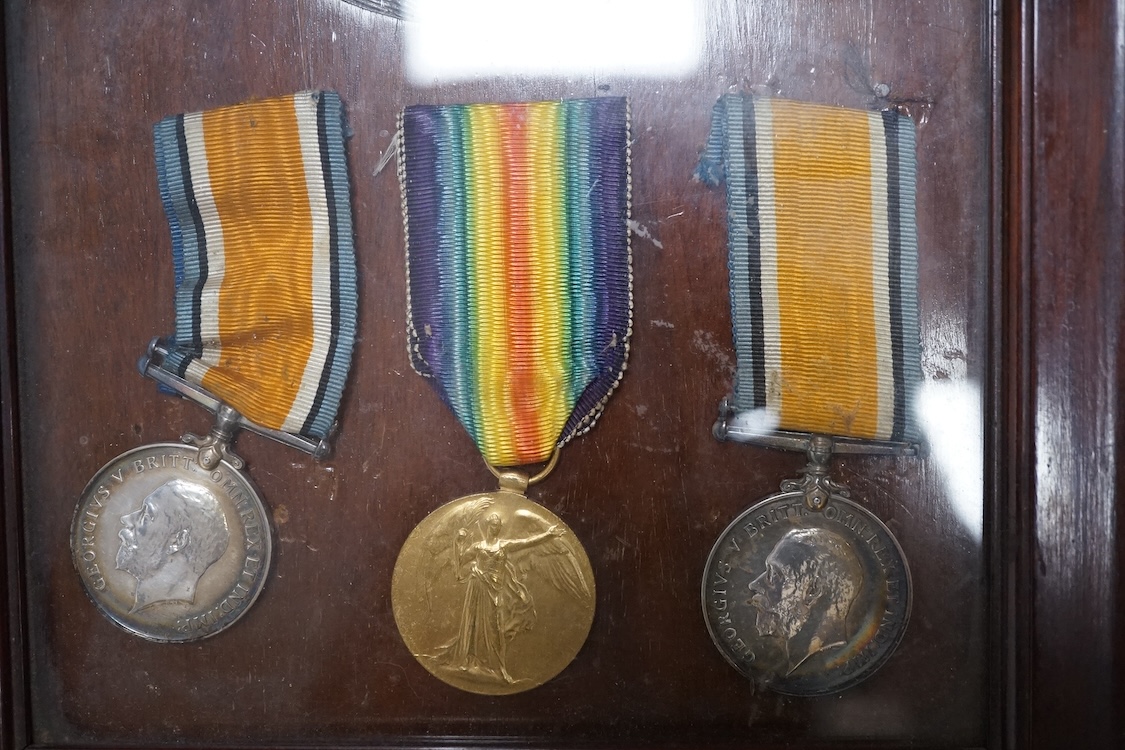 Two First World War medal groups; a framed medal trio and memorial plaque awarded to Pte. George William Stannard R.M. R.N. Division, with the scroll in a separate matching frame, together with a medal pair awarded to 20